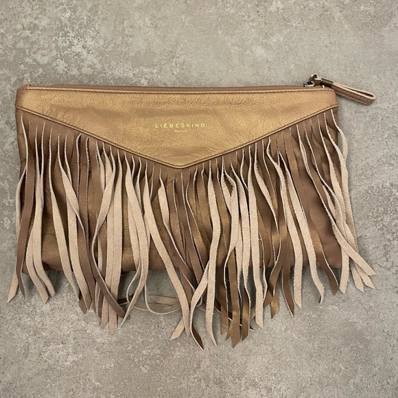 Liebeskind Handbags - Liebeskind Berlin leather gold / bronze tassel clutch